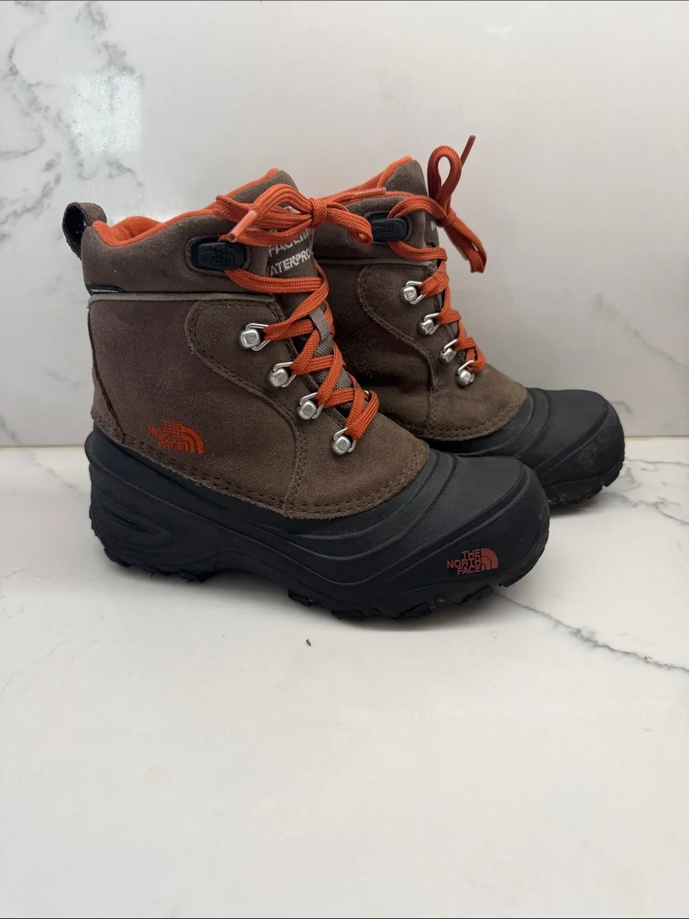 The North Face Brown Suede Kids Boots with Orange Laces